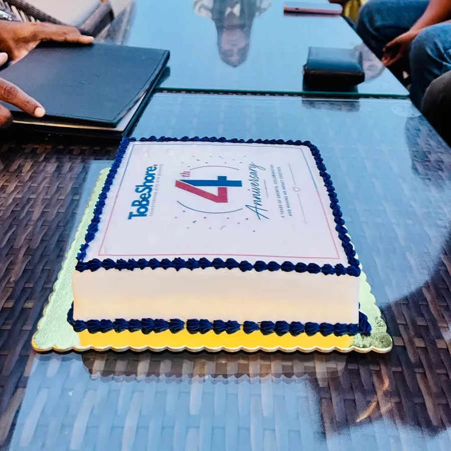 Anniversary cake decorated with the ToBeShore logo and the words 4th Anniversary